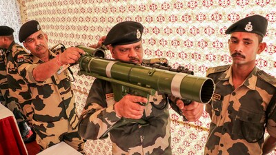 BSF personnel display weapons during an exhibition organised as part of their preparedness, in Jammu on Tuesday, (PTI) BSF personnel display weapons during an exhibition organised as part of their preparedness, in Jammu on Tuesday, (PTI)