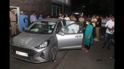 Police and forensic experts inspect the vehicle in which seven members of a family allegedly consumed poison, in Panchkula, on Tuesday. (Sant Arora/HT) Police and forensic experts inspect the vehicle in which seven members of a family allegedly consumed poison, in Panchkula, on Tuesday. (Sant Arora/HT)