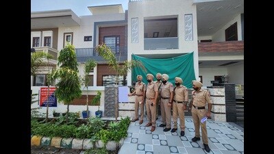 Police party at the property of dismissed constable Amandeep Kaur in Bathinda on Monday. (Sanjeev Kumar/HT) Police party at the property of dismissed constable Amandeep Kaur in Bathinda on Monday. (Sanjeev Kumar/HT)