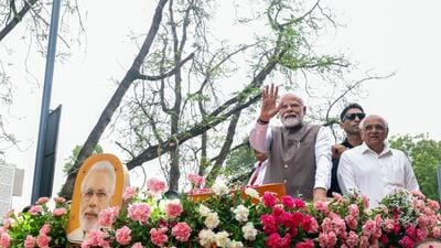 Prime Minister Narendra Modi waves to the gathering during a roadshow, in Gandhinagar on Tuesday. (ANI) Prime Minister Narendra Modi waves to the gathering during a roadshow, in Gandhinagar on Tuesday. (ANI)