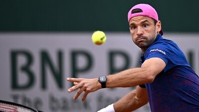 Bulgaria's Grigor Dimitrov eyes the ball as he plays a forehand return to US Ethan Quinn during their men's singles match on day 3 of the French Open tennis tournament at the Roland-Garros Complex in Paris on May 27, 2025. (Photo by JULIEN DE ROSA / AFP) (AFP) Bulgaria's Grigor Dimitrov eyes the ball as he plays a forehand return to US Ethan Quinn during their men's singles match on day 3 of the French Open tennis tournament at the Roland-Garros Complex in Paris on May 27, 2025. (Photo by JULIEN DE ROSA / AFP) (AFP)