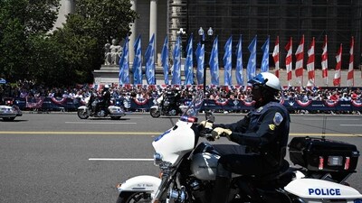 Police officer rides his motorcycle on Constitution Avenue during the National Memorial Day Parade on Constitution Avenue in Washington, DC, May 26, 2025. (Photo by ALEX WROBLEWSKI / AFP) (AFP) Police officer rides his motorcycle on Constitution Avenue during the National Memorial Day Parade on Constitution Avenue in Washington, DC, May 26, 2025. (Photo by ALEX WROBLEWSKI / AFP) (AFP)