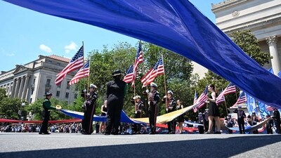 People arrive to participate at the National Memorial Day Parade on Constitution Avenue in Washington, DC, May 26, 2025. (Photo by ALEX WROBLEWSKI / AFP) (AFP) People arrive to participate at the National Memorial Day Parade on Constitution Avenue in Washington, DC, May 26, 2025. (Photo by ALEX WROBLEWSKI / AFP) (AFP)