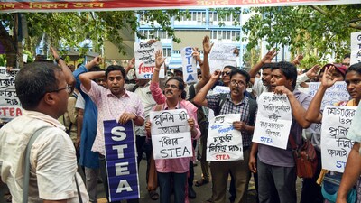 Teachers and non-teaching staff stage a sit-in protest against police lathi-charge on protesters on May 15 in front of Bikash Bhawan in Kolkata (ANI/File) Teachers and non-teaching staff stage a sit-in protest against police lathi-charge on protesters on May 15 in front of Bikash Bhawan in Kolkata (ANI/File)