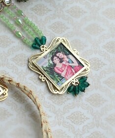 Custom-made rakhi with a photo frame inside by BeAbhika. Custom-made rakhi with a photo frame inside by BeAbhika.