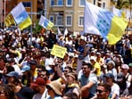 Protesters in the Canary Islands (Spain) hold up posters reading, ‘Canaries have a limit'