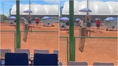 The Pakistan player (L) attempts to forcefully strike India player's hand (X) The Pakistan player (L) attempts to forcefully strike India player's hand (X)