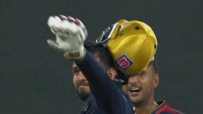 Jitesh Sharma swings his helmet after RCB's win over LSG (IPL) Jitesh Sharma swings his helmet after RCB's win over LSG (IPL)