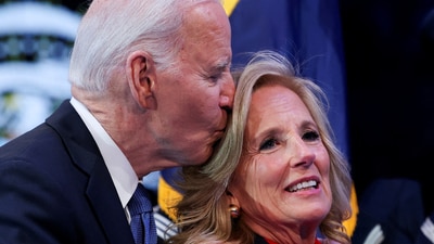 Former President Joe Biden kisses Jill Biden after she received a Department of Defense medal for Distinguished Public Service (REUTERS)