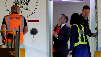 Macron dismissed having a "domestic dispute" with his wife, telling reporters that they were "joking, as we often do." (REUTERS)