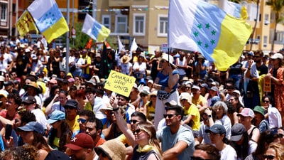 Protesters in the Canary Islands (Spain) hold up posters reading, ‘Canaries have a limit' Protesters in the Canary Islands (Spain) hold up posters reading, ‘Canaries have a limit'