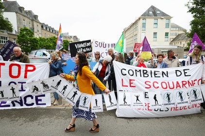 A group of alleged victims, members of women's collectives, NGO's and unions gather in front of the courthouse, on the day of the verdict of ex-surgeon Joel Le Scouarnec, charged with the aggravated rape and sexual assault against hundreds of children over several decades, in Vannes, Brittany, France. (REUTERS)