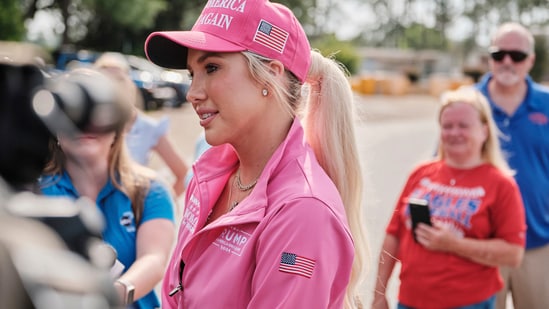 Savannah Chrisley, daughter of reality television star Todd Chrisley, speaks outside the Federal Prison Camp (AP)