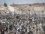 Palestinians at a distribution center for humanitarian aid in the Netzarim Corridor, central Gaza Strip, on Thursday, May 29, 2025. Palestinians at a distribution center for humanitarian aid in the Netzarim Corridor, central Gaza Strip, on Thursday, May 29, 2025.
