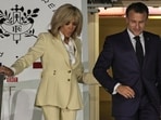 Emmanuel Macron & his wife's shocking conversation after shoving incident decoded by lip reader (Photo by YASUYOSHI CHIBA / AFP) Emmanuel Macron & his wife's shocking conversation after shoving incident decoded by lip reader (Photo by YASUYOSHI CHIBA / AFP)