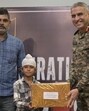 Major General Ranjit Singh Manral, GOC, 7th Infantry Division, felicitating Shravan Singh in Ferozepur. (HT photo)