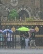 People commute amid torrential rains in Mumbai on Wednesday. (ANI Photo) People commute amid torrential rains in Mumbai on Wednesday. (ANI Photo)