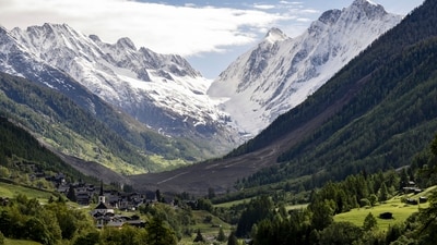 A massive debris avalanche, with the village of Kippel in the foreground, is seen on Thursday, May 29, 2025, one day after the collapse of the Birch Glacier causing the demolishing of the village of Blatten in Switzerland. AP/PTI(AP05_29_2025_000156B) (AP) A massive debris avalanche, with the village of Kippel in the foreground, is seen on Thursday, May 29, 2025, one day after the collapse of the Birch Glacier causing the demolishing of the village of Blatten in Switzerland. AP/PTI(AP05_29_2025_000156B) (AP)