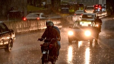 Commuters ride along a street as it rains in the Peshawar district of the Khyber Pakhtunkhwa province of Pakistan on May 27, 2025. (AFP File) Commuters ride along a street as it rains in the Peshawar district of the Khyber Pakhtunkhwa province of Pakistan on May 27, 2025. (AFP File)
