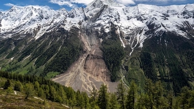 This photograph taken above Wiler shows the Bietschhorn mountain in the Swiss Alps after part of the huge Birch Glacier collapsed the day before and destroyed the small village of Blatten, on May 29, 2025. Swiss authorities were on May 29, 2025 monitoring for possible flood risk in a southern valley, following a massive glacier collapse that created a huge pile of debris after destroying a small village. On May 28 the Birch glacier in Switzerland's southern Wallis region collapsed, sending tons of rock, ice and scree hurtling down the mountain slope and into the valley below. The barrage largely destroyed the hamlet of Blatten, which had been home to 300 people and was evacuated last week due to the impending danger. (Photo by FABRICE COFFRINI / AFP) (AFP) This photograph taken above Wiler shows the Bietschhorn mountain in the Swiss Alps after part of the huge Birch Glacier collapsed the day before and destroyed the small village of Blatten, on May 29, 2025. Swiss authorities were on May 29, 2025 monitoring for possible flood risk in a southern valley, following a massive glacier collapse that created a huge pile of debris after destroying a small village. On May 28 the Birch glacier in Switzerland's southern Wallis region collapsed, sending tons of rock, ice and scree hurtling down the mountain slope and into the valley below. The barrage largely destroyed the hamlet of Blatten, which had been home to 300 people and was evacuated last week due to the impending danger. (Photo by FABRICE COFFRINI / AFP) (AFP)