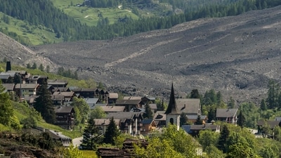 This photograph taken from Ferden shows a huge landslide next to the village of Wiler, on May 29, 2025, the day after the Birch Glacier collapsed and partially destroyed the small village of Blatten in the Swiss Alps. A massive glacier collapse on May 28, 2025 in southern Switzerland partially destroyed the small village of Blatten, which had been completely evacuated last week due to the impending danger, officials said. Around 3:30 pm (1330 GMT) a huge collapse occurred on the Birch Glacier, emergency services in the Wallis region said. (Photo by FABRICE COFFRINI / AFP) (AFP) This photograph taken from Ferden shows a huge landslide next to the village of Wiler, on May 29, 2025, the day after the Birch Glacier collapsed and partially destroyed the small village of Blatten in the Swiss Alps. A massive glacier collapse on May 28, 2025 in southern Switzerland partially destroyed the small village of Blatten, which had been completely evacuated last week due to the impending danger, officials said. Around 3:30 pm (1330 GMT) a huge collapse occurred on the Birch Glacier, emergency services in the Wallis region said. (Photo by FABRICE COFFRINI / AFP) (AFP)