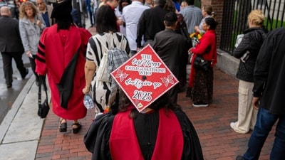 A Harvard University student wearing a graduation cap and gown walks through Harvard Square in Cambridge, Massachusetts, US, on Thursday, May 29, 2025. US President Donald Trump said Harvard University should cap foreign student enrollment at 15%, ratcheting up his effort to force policy changes at the elite institution. Photographer: Mel Musto/Bloomberg (Bloomberg) A Harvard University student wearing a graduation cap and gown walks through Harvard Square in Cambridge, Massachusetts, US, on Thursday, May 29, 2025. US President Donald Trump said Harvard University should cap foreign student enrollment at 15%, ratcheting up his effort to force policy changes at the elite institution. Photographer: Mel Musto/Bloomberg (Bloomberg)