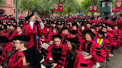 Graduates gather to attend the commencement ceremony at Harvard University in Cambridge (AFP) Graduates gather to attend the commencement ceremony at Harvard University in Cambridge (AFP)