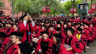 Graduates gather to attend the commencement ceremony at Harvard University in Cambridge, Massachusetts, on May 29, 2025. US President Donald Trump is furious at Harvard for rejecting his administration's push for oversight on admissions and hiring, amid the president's claims the school is a hotbed of anti-Semitism and "woke" liberal ideology. (Photo by Rick Friedman / AFP) (AFP) Graduates gather to attend the commencement ceremony at Harvard University in Cambridge, Massachusetts, on May 29, 2025. US President Donald Trump is furious at Harvard for rejecting his administration's push for oversight on admissions and hiring, amid the president's claims the school is a hotbed of anti-Semitism and "woke" liberal ideology. (Photo by Rick Friedman / AFP) (AFP)
