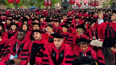 Graduates gather as they attend commencement ceremony at Harvard University in Cambridge, Massachusetts, on May 29, 2025. US President Donald Trump is furious at Harvard for rejecting his administration's push for oversight on admissions and hiring, amid the president's claims the school is a hotbed of anti-Semitism and "woke" liberal ideology. (Photo by Eva Claire HAMBACH / AFP) (AFP) Graduates gather as they attend commencement ceremony at Harvard University in Cambridge, Massachusetts, on May 29, 2025. US President Donald Trump is furious at Harvard for rejecting his administration's push for oversight on admissions and hiring, amid the president's claims the school is a hotbed of anti-Semitism and "woke" liberal ideology. (Photo by Eva Claire HAMBACH / AFP) (AFP)