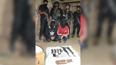 The two terrorists surrendered to Shopian police after an operation was launched in the Baskuchan area. (X/@ANI) The two terrorists surrendered to Shopian police after an operation was launched in the Baskuchan area. (X/@ANI)