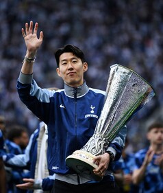 Son Heung-min with his first club trophy. (Reuters) Son Heung-min with his first club trophy. (Reuters)