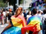 FILE - People wrapped in rainbow flags take part in the LGBTQ+ Pride parade in Rome, Saturday, June 10, 2023. (Cecilia Fabiano/LaPresse via AP, File) FILE - People wrapped in rainbow flags take part in the LGBTQ+ Pride parade in Rome, Saturday, June 10, 2023. (Cecilia Fabiano/LaPresse via AP, File)