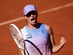 Poland's Iga Swiatek celebrates after winning against Romania's Jaqueline Cristian at the end of their women's singles Poland's Iga Swiatek celebrates after winning against Romania's Jaqueline Cristian at the end of their women's singles