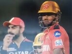 Virat Kohli can be seen chatting with his teammate about Musheer Khan