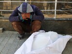 A mourner reacts next to the body of a Palestinian killed in Israeli strikes, at Al Shifa hospital, in Gaza City, May 30.