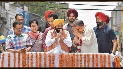 AAP national convener Arvind Kejriwal, former Delhi CM Atishi Marlena, Punjab CM Bhagwant Mann and Punjab AAP president Aman Arora accompanying party candidate Sanjeev Arora for filing of nomination papers in Ludhiana on Friday. They took out a roadshow from Aarti Chowk and ended at Bhai Bala Chowk in the city. (Gurpreet Singh/HT)