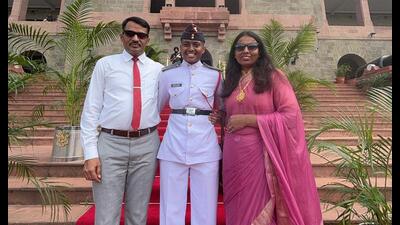 Ishita Sangwan from Charkhi Dadri, flanked by her parents, Charan Singh Sangwan and Anita Sangwan after graduating from NDA. (HT Photo) Ishita Sangwan from Charkhi Dadri, flanked by her parents, Charan Singh Sangwan and Anita Sangwan after graduating from NDA. (HT Photo)