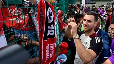 Manchester United player Diogo Dalot signing an autograph for fans during  meet-and-greet session with soccer fans in Mumbai on Thursday (Hindustan Times)