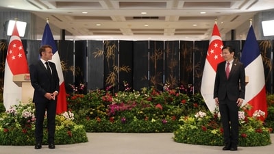 France's President Emmanuel Macron (L) and Singapore's Prime Minister Lawrence Wong wait for the start of a ceremony in Singapore on May 30, 2025. (Photo by Ludovic MARIN / AFP) (AFP) France's President Emmanuel Macron (L) and Singapore's Prime Minister Lawrence Wong wait for the start of a ceremony in Singapore on May 30, 2025. (Photo by Ludovic MARIN / AFP) (AFP)