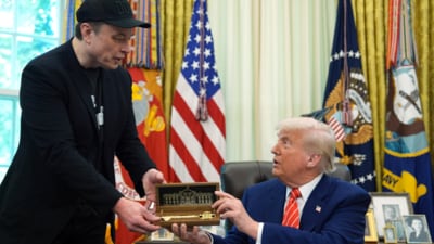 President Donald Trump, right, presents a key to Elon Musk during a news conference in the Oval Office of the White House, Friday, May 30, 2025, in Washington. (AP Photo/Evan Vucci) President Donald Trump, right, presents a key to Elon Musk during a news conference in the Oval Office of the White House, Friday, May 30, 2025, in Washington. (AP Photo/Evan Vucci)