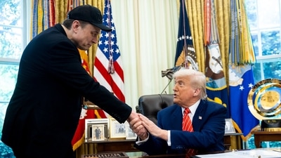 US President Donald Trump, right, and Elon Musk, chief executive officer of Tesla Inc., shake hands during a news conference in the Oval Office of the White House in Washington, DC, US, on Friday, May 30, 2025. The event gives an opportunity for the president and his largest campaign benefactor to dispel any notion of an acrimonious divorce. Photographer: Francis Chung/Politico/Bloomberg (Bloomberg) US President Donald Trump, right, and Elon Musk, chief executive officer of Tesla Inc., shake hands during a news conference in the Oval Office of the White House in Washington, DC, US, on Friday, May 30, 2025. The event gives an opportunity for the president and his largest campaign benefactor to dispel any notion of an acrimonious divorce. Photographer: Francis Chung/Politico/Bloomberg (Bloomberg)