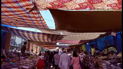 The bazar lane is like a tunnel, lined on both sides with dozens of small stalls. It is roofed by a most unusual covering, which comes up only during the summer months. (HT PHOTO) The bazar lane is like a tunnel, lined on both sides with dozens of small stalls. It is roofed by a most unusual covering, which comes up only during the summer months. (HT PHOTO)