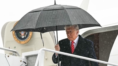 US President Donald Trump holds an umbrella as he exits Air Force One upon arrival at Allegheny County Airport in West Mifflin, Pennsylvania, May 30, 2025. (AFP) US President Donald Trump holds an umbrella as he exits Air Force One upon arrival at Allegheny County Airport in West Mifflin, Pennsylvania, May 30, 2025. (AFP)