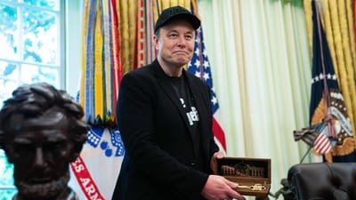 Elon Musk looks on as he holds a key given to him by US President Donald Trump during a news conference in the Oval Office of the White House in Washington, DC, on May 30, 2025. Musk, who stormed into US politics as President Trump's chainsaw-brandishing sidekick, announced on May 28 that he is leaving his role in US government, intended to reduce federal spending, shortly after his first major break with the President over Trump's signature spending bill. (Photo by Allison ROBBERT / AFP) (AFP) Elon Musk looks on as he holds a key given to him by US President Donald Trump during a news conference in the Oval Office of the White House in Washington, DC, on May 30, 2025. Musk, who stormed into US politics as President Trump's chainsaw-brandishing sidekick, announced on May 28 that he is leaving his role in US government, intended to reduce federal spending, shortly after his first major break with the President over Trump's signature spending bill. (Photo by Allison ROBBERT / AFP) (AFP)