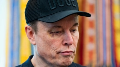 Elon Musk looks on during a news conference with US President Donald Trump in the Oval Office of the White House in Washington, DC, on May 30, 2025. Musk, who stormed into US politics as President Trump's chainsaw-brandishing sidekick, announced on May 28 that he is leaving his role in US government, intended to reduce federal spending, shortly after his first major break with the President over Trump's signature spending bill. (Photo by Allison ROBBERT / AFP) (AFP) Elon Musk looks on during a news conference with US President Donald Trump in the Oval Office of the White House in Washington, DC, on May 30, 2025. Musk, who stormed into US politics as President Trump's chainsaw-brandishing sidekick, announced on May 28 that he is leaving his role in US government, intended to reduce federal spending, shortly after his first major break with the President over Trump's signature spending bill. (Photo by Allison ROBBERT / AFP) (AFP)