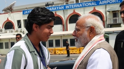 Prime Minister Narendra Modi with Vaibhav Suryavanshi  at the Patna airport. (X/Narendra Modi)