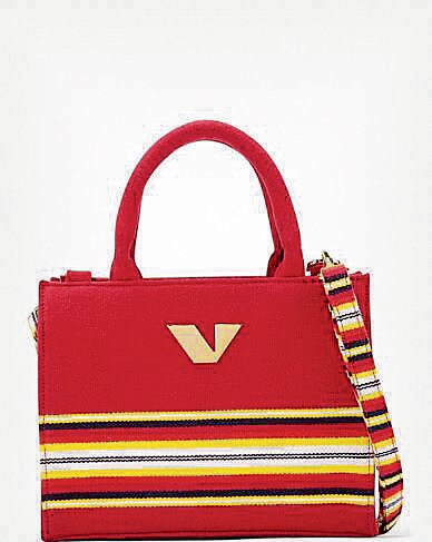 The iconic Bhavani jamakkalam stripes turn up in contemporary vibrancy, as accents on clutches and handbags. (Photo: Deepak Renganathan) The iconic Bhavani jamakkalam stripes turn up in contemporary vibrancy, as accents on clutches and handbags. (Photo: Deepak Renganathan)
