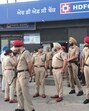 Police at the crime spot where three masked men robbed <span class='webrupee'>₹</span>40 lakh from the HDFC Bank branch situated in Rihanna-Jattan village alongside Phagwara-Hoshiarpur road in Kapurthala district on Friday. (HT Photo) Police at the crime spot where three masked men robbed <span class='webrupee'>₹</span>40 lakh from the HDFC Bank branch situated in Rihanna-Jattan village alongside Phagwara-Hoshiarpur road in Kapurthala district on Friday. (HT Photo)