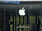 FILE - People sit in front of an Apple Store in Duesseldorf, Germany, Monday, April 7, 2025. (AP Photo/Martin Meissner, File) FILE - People sit in front of an Apple Store in Duesseldorf, Germany, Monday, April 7, 2025. (AP Photo/Martin Meissner, File)