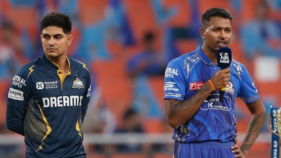 Gujarat Titans' captain Shubman Gill, left, looks away as Mumbai Indians' captain Hardik Pandya speaks (AP) Gujarat Titans' captain Shubman Gill, left, looks away as Mumbai Indians' captain Hardik Pandya speaks (AP)